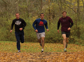 Three students running Three students running