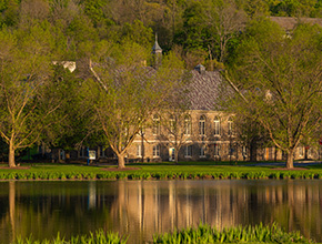 A pond in front of a building. Link to Life Stage Gift Planner Ages 60-70 Situations.